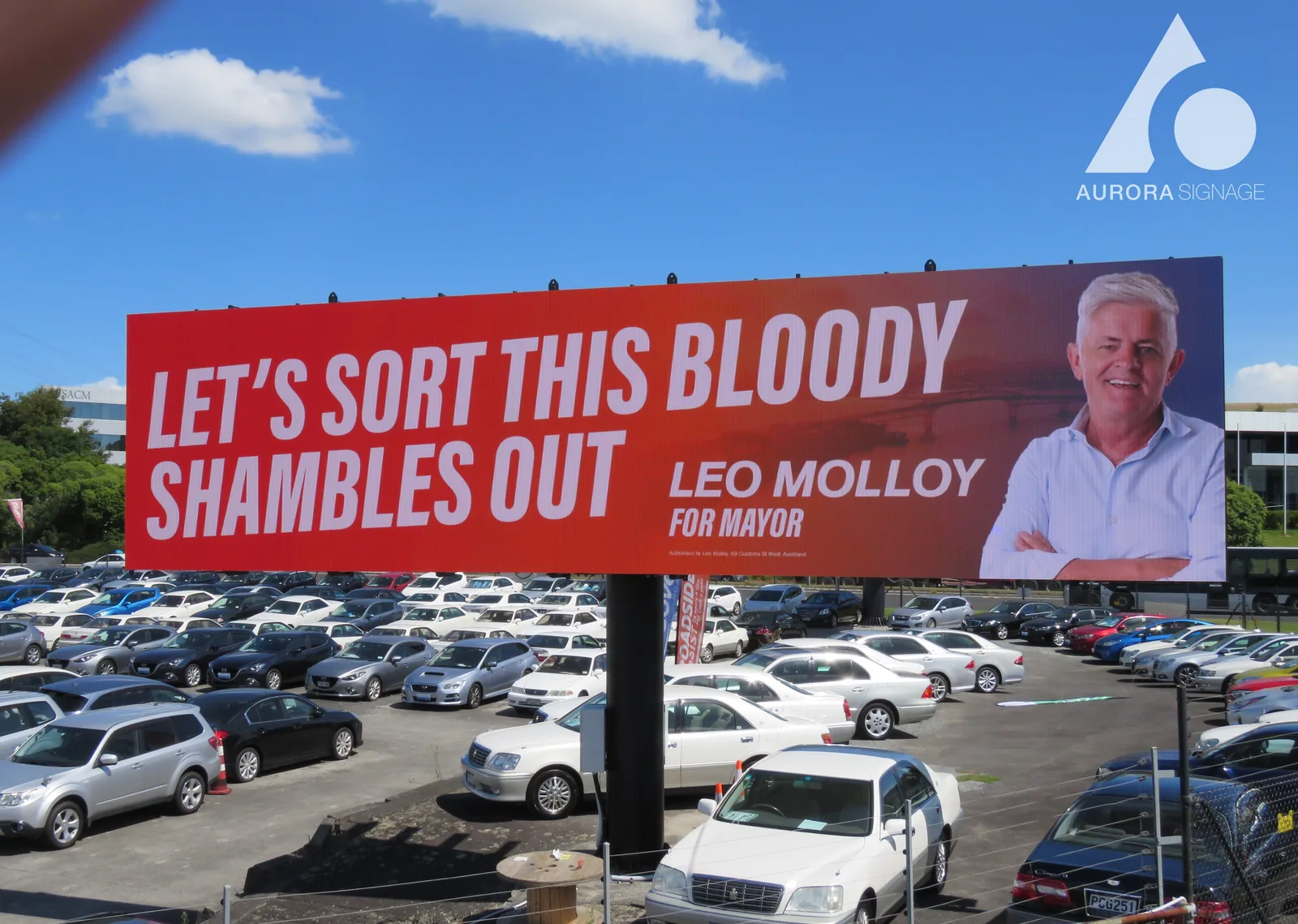 Aurora LUX P6.67 outdoor LED billboard for Go Media in New Zealand displaying a Leo Molloy for Mayor campaign creative above a car park